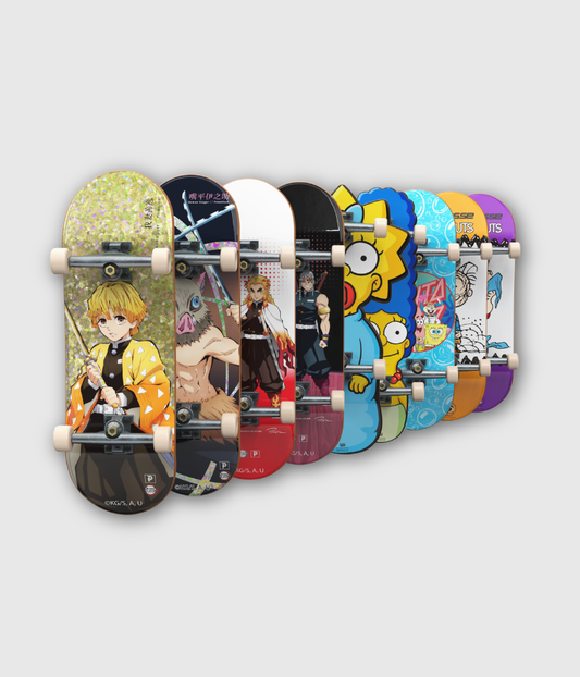 A set of ten colorful skateboards with various anime and cartoon designs, arranged in a row against a light gray background.