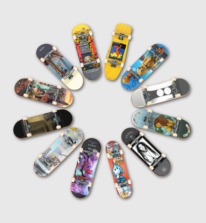 Twelve skateboard decks arranged in a circular pattern on a light gray background, each showing a different colorful graphic design on the underside.